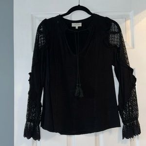 Black going out top with lacey/sheer arms.
